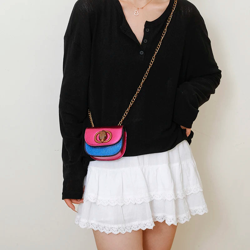Classic Women Handbag Leather Crossbody Bag worn with a black top and white skirt, showcasing a stylish outfit.